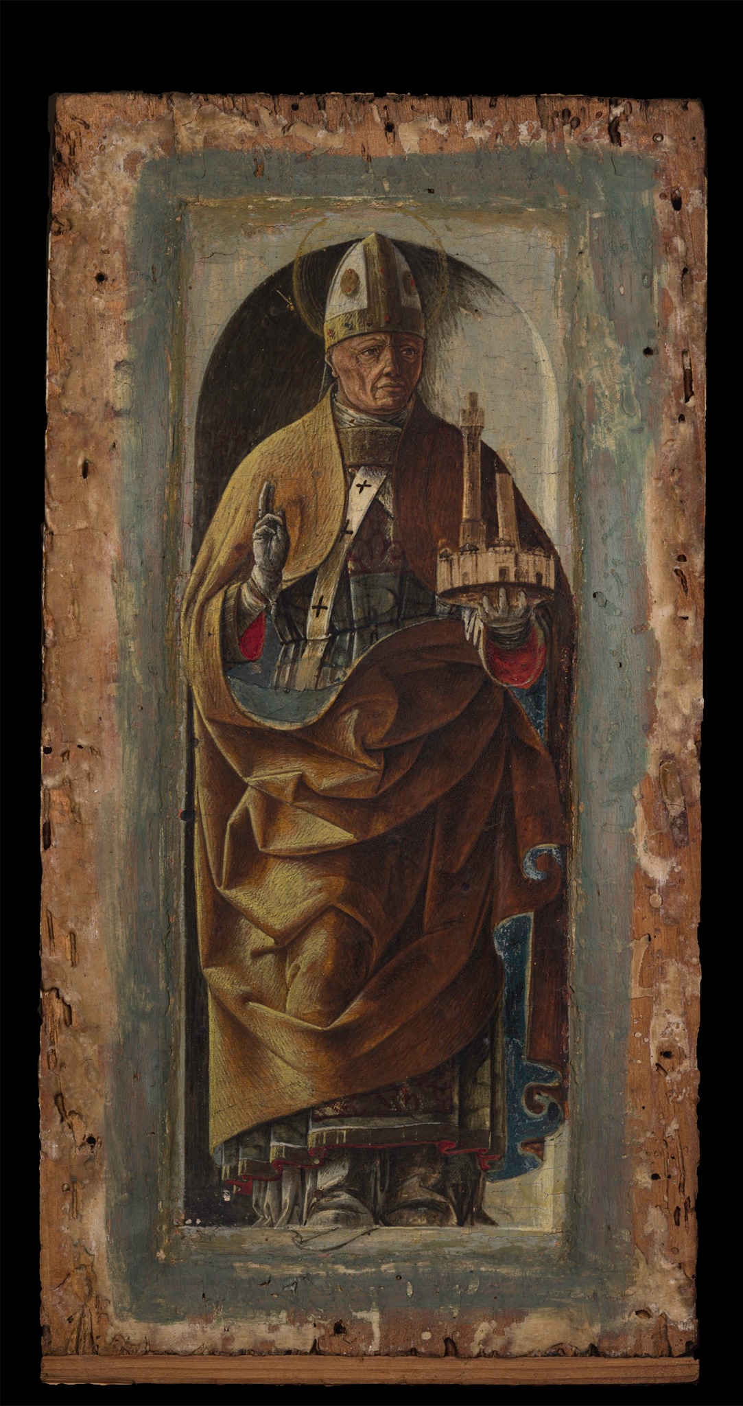 Ercole de’ Roberti (Ferrara, 1450 ca.–1496), San Petronio, 1470-73 ca., tempera su tavola, cm 26 x 14. Il dipinto era in origine uno dei riquadri che decoravano con figure di santi i pilastrini laterali del polittico Griffoni, dipinto da Francesco del Cossa per la basilica di San Petronio a Bologna nel 1470-73. L’artista ferrarese si avvalse della collaborazione del giovane Ercole de’ Roberti, cui fu affidata l’esecuzione degli scomparti minori del polittico e della predella (oggi Pinacoteca Vaticana). Da San Petronio a Bologna, l'opera passa nelle collezioni di Ferrara, ed entra in Pinacoteca nel 1973 con la donazione Vendeghini.