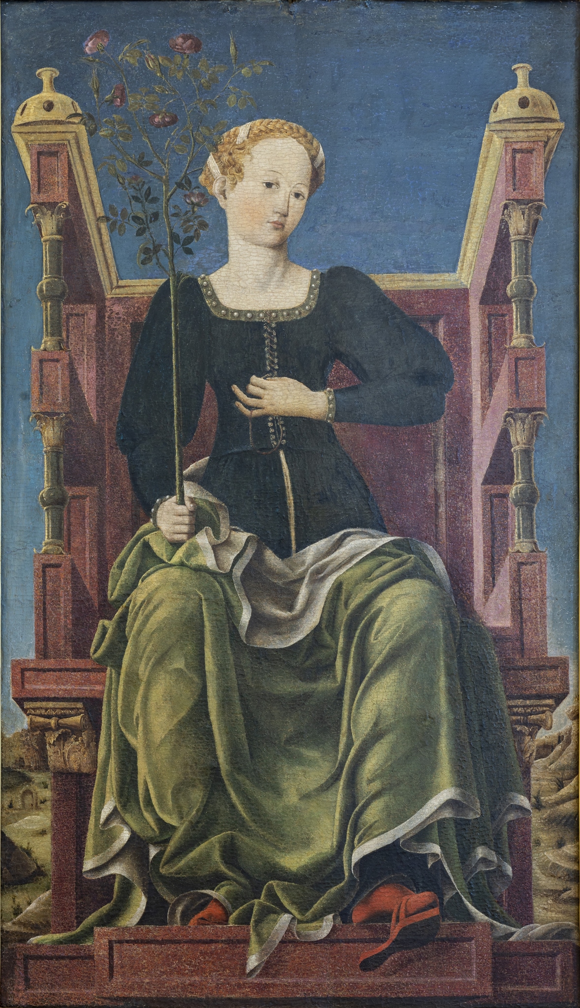 Primo pittore dello studiolo (Angelo Maccagnino?) e Secondo pittore dello studiolo, La musa Erato (?), 1450-55 ca. e 1456-58 ca., tempera su tavola, cm 123,5 x 72. Prima di pervenire alla collezione Struzzi Sacrati e di qui in Pinacoteca, il dipinto era parte della serie raffigurante le muse che decorava lo studiolo della villa di Belfiore, fatto cominciare da Leonello d’Este e ultimato da suo fratello Borso. La figura è, forse, Erato, musa della poesia amorosa che regge in mano un ramo di rose. La parte inferiore della figura, con la straordinaria trovata dello zoccolo che vien fatto dondolare oltre il gradino del trono, è di mano di un artista diverso da quello che ha dipinto il resto della figura e il trono. Villa di Belfiore a Ferrara; collezione Strozzi Sacrati a Ferrara e a Firenze; acquistato dallo Stato per la Pinacoteca Nazionale nel 1992.