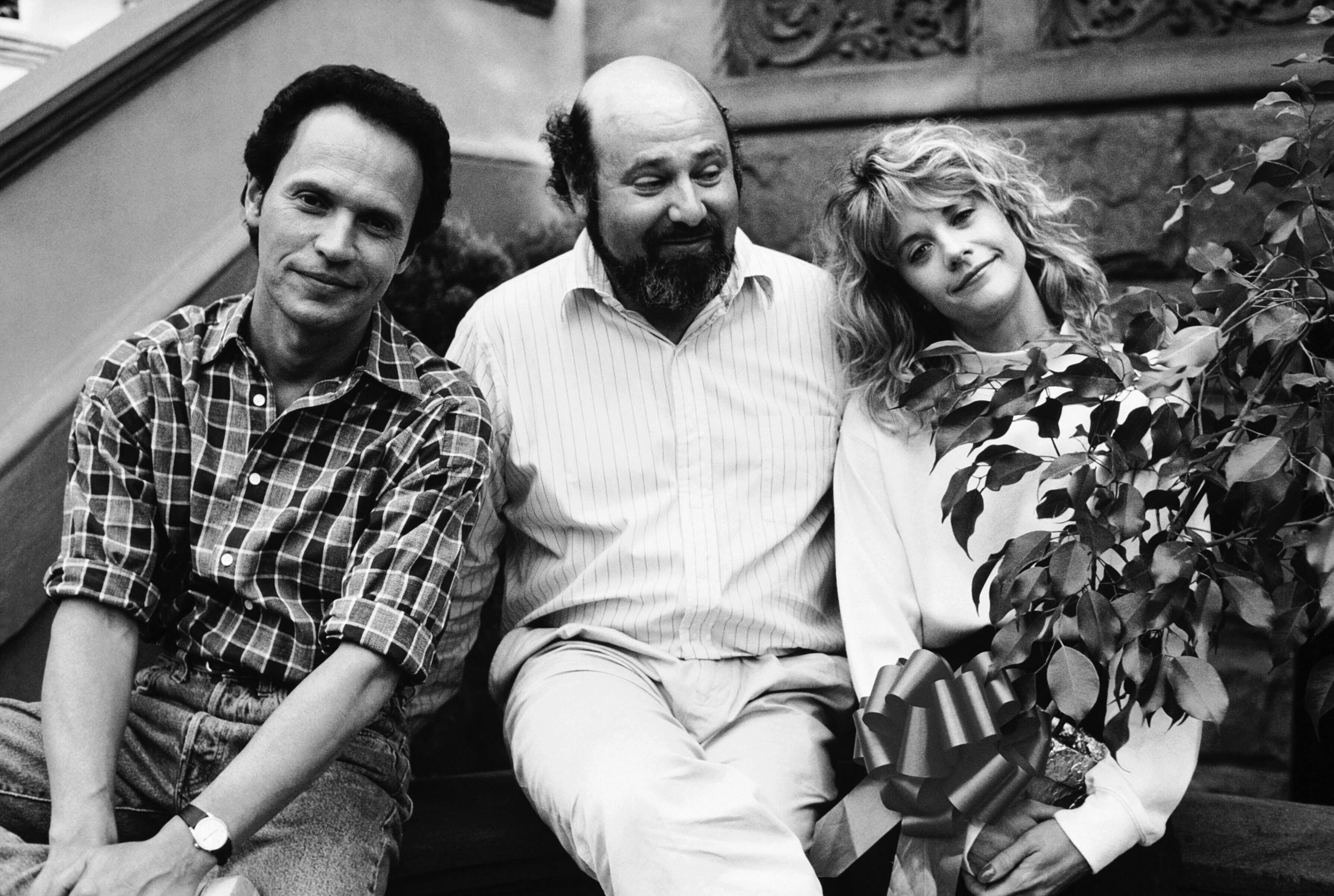 1989. Da sinistra: Billy Crystal, il regista Bob Reiner e Meg Ryan sul set di "Herry ti presento Sally"